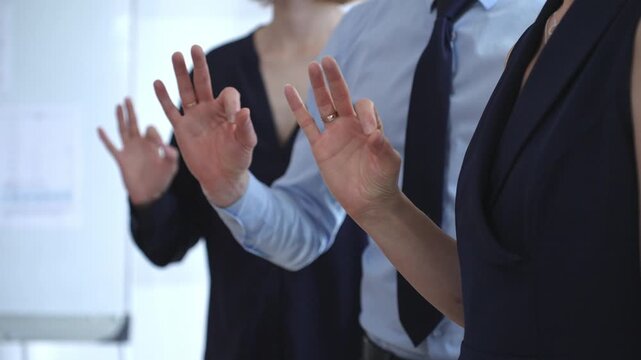 Business people showing ok gesture, affirming agreement, teamwork, and success, expressing satisfaction, approval, and support in a professional setting