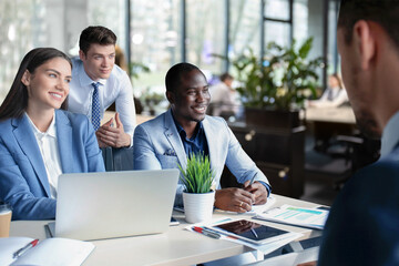 Professional executive businesspeople discuss corporation project planning sit at meeting room, brainstorm financial plan working together in office.