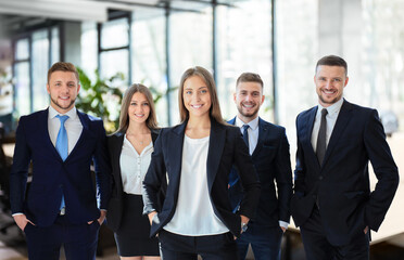 Group portrait of a professional business team looking confidently at camera