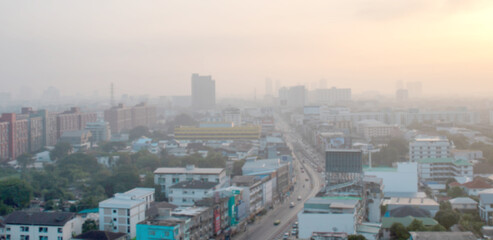 Blurred view of Bangkok cityscape covered in smog, seen from above. tall buildings hidden in haze, Perfect for background use or depicting air pollution in urban environments