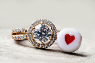 Wedding ring and red heart beads. Love and family.