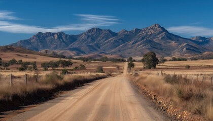 Rustic Country Pathway Towards The Majestic Flinders Ranges Mountains In South Australia, Covered With Gravel And Surrounded By Nature.