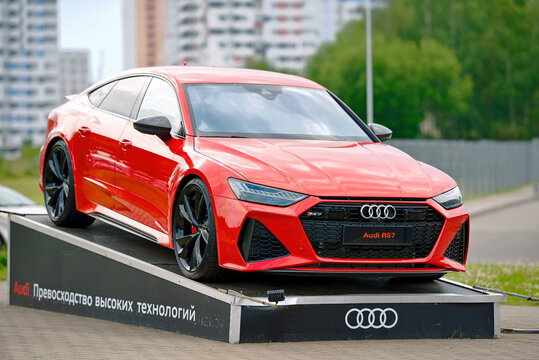 Minsk, Belarus. Jun 17, 2024. Red Audi RS7 luxury performance car parked on outdoor podium near audi dealership, elegant design and premium german automotive engineering