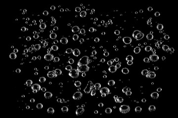 Abstract close-up of transparent water bubbles isolated on black background, symbolizing freshness, purity, and minimalism. Perfect for science, nature, or clean water concept designs.