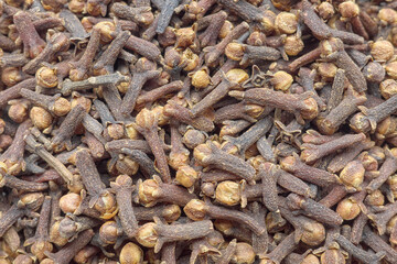 Closeup photo of whole cloves, selective focus.