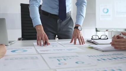 Business people team analyzing financial charts and graphs during strategy meeting in modern office, focusing on corporate planning, and decision making - Powered by Adobe