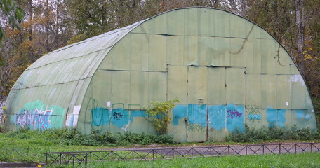 A large green semi-circular sheeting hangar, Granite Street, Saint Petersburg, Russia, October 12, 2025