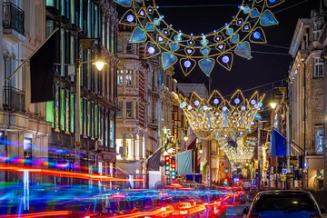 Fotobehang Londen rode bus Classic red double-decker bus on festive London street at night  © Alexey Fedorenko