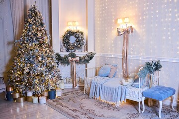 The interior of a room decorated for the new year. Beautiful Christmas tree decorations