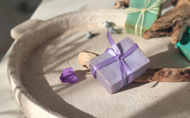 Cubes of natural soap against backdrop of natural elements. Handicrafts and hobbies. Cosmetics and beauty. Eco-friendly products. Background, composition for design.