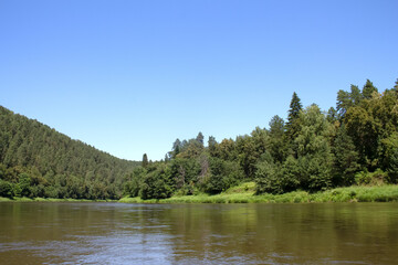 photo of the Ural River. hills and trees around
