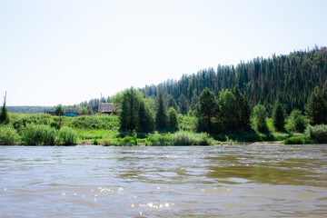 photo of the Ural River. hills and trees around