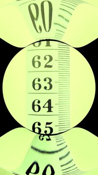 Vertical video social media - Closeup overhead shot moving along a numerical measure with increasing numbers and a toric lens effect.