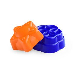 A set of children's molds for creating sand shapes on a white background.