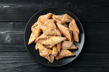 Angel Wings, Faworki, cakes. sweet pastry deep fried and sprinkled with powdered sugar.