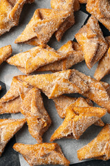 Angel Wings, Faworki, cakes. sweet pastry deep fried and sprinkled with powdered sugar.
