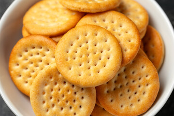 Cheese baked cheddar crackers in a white bowl