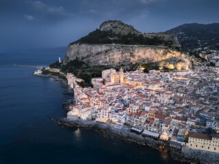 Mediterranean seaside town with narrow streets, old cathedral and big mountain, Cefalu, Sicily, Italy