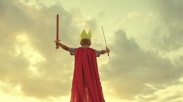 happy family. little boy playing with ball sunset wearing golden paper crown. chidhood dream. kid child plays park against sky. superhero child red cape. superhero child play concept.outdoors. chid.
