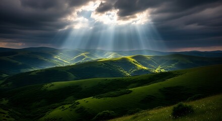Sunbeams breaking through dramatic clouds over rolling green hills.