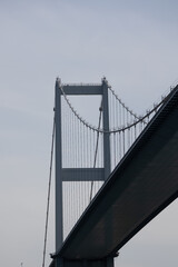Fragment of big modern suspension bridge on sunny day against clear sky, Istanbul, Turkey