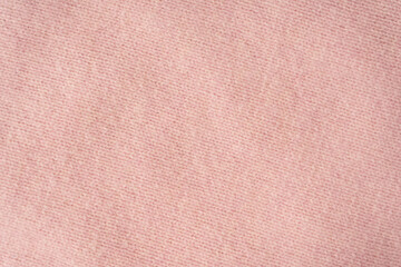 Soft pink cashmere sweater texture background.