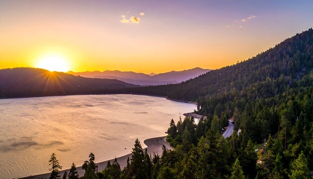 A majestic sunrise over a serene lake framed by a dense, green forest on a hillside. The golden light bathes the scene - Powered by Adobe