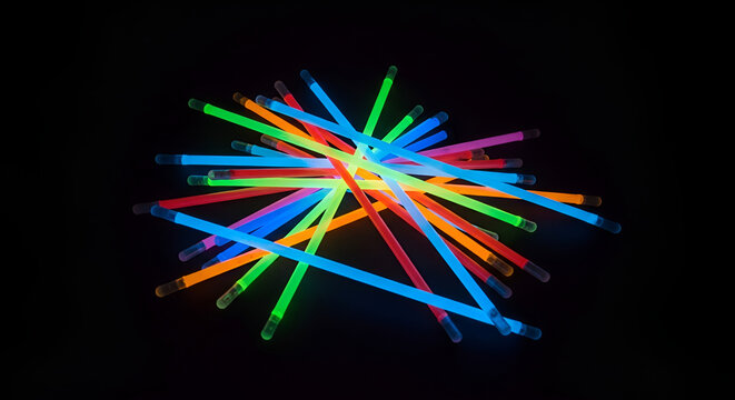 Colorful glow sticks party supplies glowing neon light sticks for events and celebrations dark background