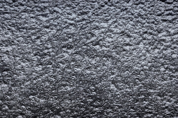 Closeup photo of closed cell polyethylene foam surface, abstract background.