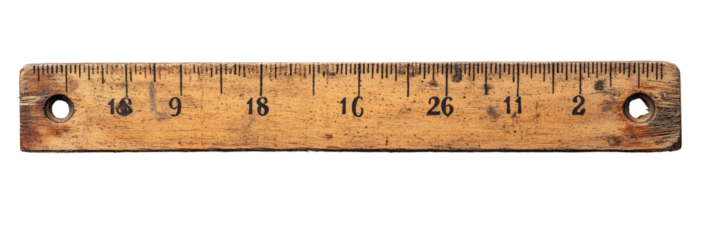 Aged wooden ruler with markings and holes