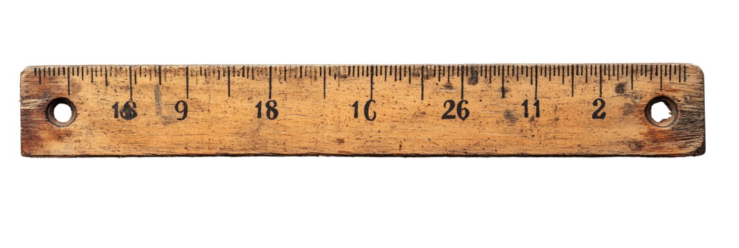 Aged wooden ruler with markings and holes