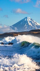 Coastal scene featuring large ocean waves and a snow-capped mountain