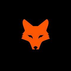 Obraz premium Minimalist orange fox face silhouette on a black background