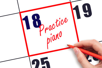 18 th day of the month.  Hand writing Practice piano reminder and drawing red frame on calendar...