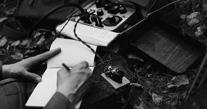 Historical Re-enactment Black And White . Russian Soviet Infantry Red Army Soldier In World War II using Russian Soviet Portable Radio Transceiver In Trench Entrenchment In Spring Autumn Forest. 4K