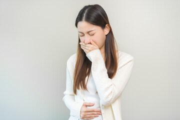 Unhappy pregnant asian young woman, pain girl suffering from nausea, having vomit feeling sick...