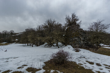 Rocky and snowy Winter landscape near Oxya Viewpoint at Vikos Gorge in Zagoria region at Pindus Mountains, Epirus, Greece