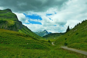 Austrian Alps - view of tourists on the road near Lake Körbersee in the Lechtal Alps