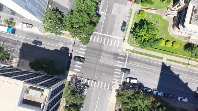 Cars, trucks and trailer movement in downtown Austin, Texas. A true representation of a typical day in the capital's urban core. Aerial drone 4k view
