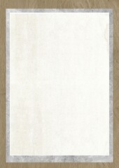 Blank white paper with textured border on wooden surface