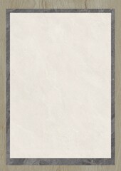 Blank textured paper sheet framed with a dark border on a wooden surface