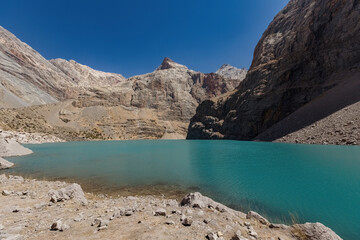 Big Allo lake view with mountain range and turquoise water in Fann mountains Pamir Alay Tajikistan