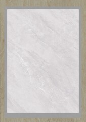 Close-up of a white marble surface with subtle gray veining, framed by a light wooden border.