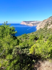 fantastic blue seascape, rocky sea coast, blue sea and blue sky