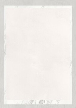 Blank white sheet of paper with faint border texture