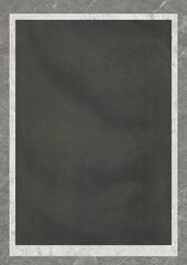 Blank chalkboard with white frame on textured background