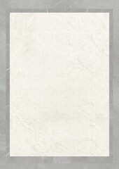 Close-up of a textured white surface with subtle gray veining, framed by a darker border.