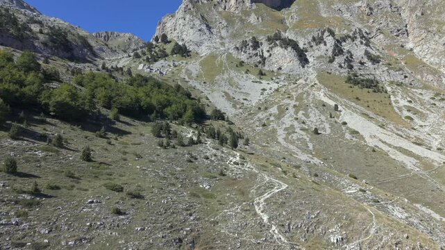 A hike day to the Albanian Mountains up to the border of Montenegro follow by a drone during Autumn or late summer season