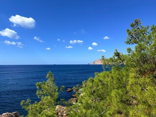 fantastic blue seascape, rocky sea coast, blue sea and blue sky