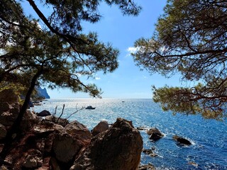 fantastic blue seascape, rocky sea coast, blue sea and blue sky